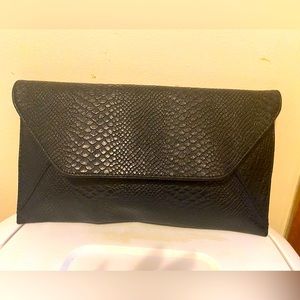 Envelope clutch great for a night on the town! Pair with a nice pant suit!
